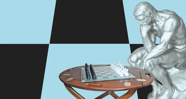 Image of the thinker statue contemplating his next move in chess with a chess board background